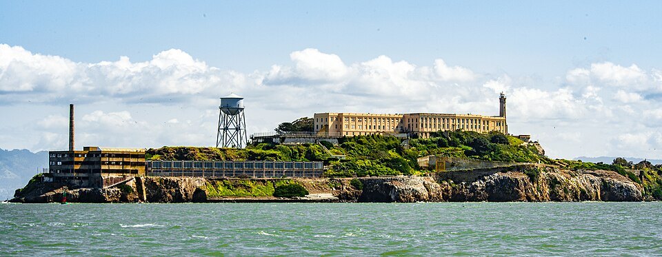 The whole island from the bay: the Water Tower, the cellhouse and the lighthouse