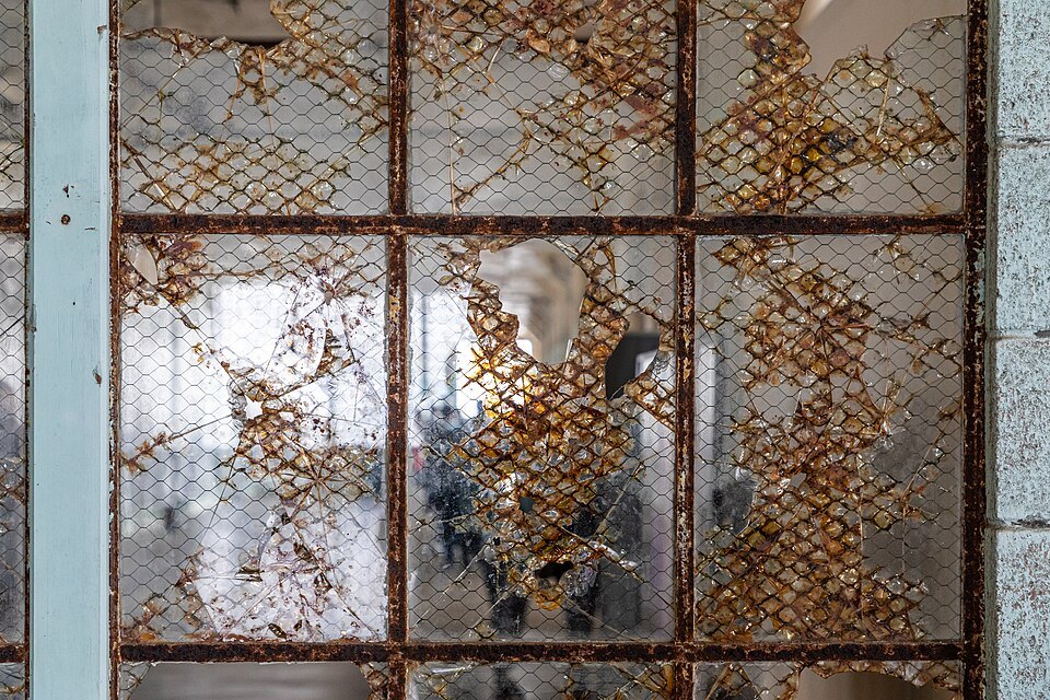 A rusted window grille on the New Industries Building on Alcatraz
