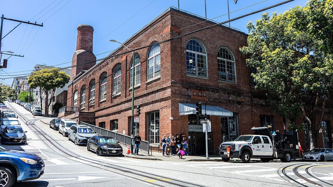The red-brick Cable Car Museum at Washington and Mason, cable car tracks curving past it
