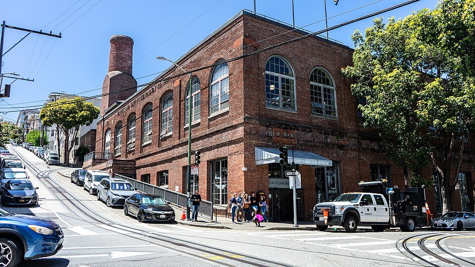 The red-brick Cable Car Museum at Washington and Mason, cable car tracks curving past it