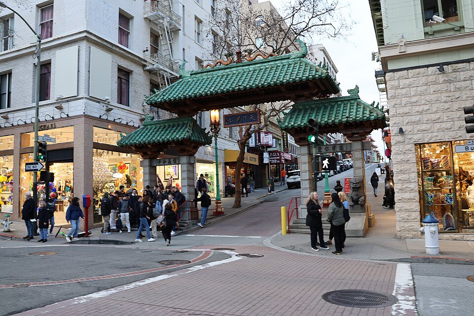 The Dragon Gate at Grant Avenue and Bush Street, with visitors crossing beneath it