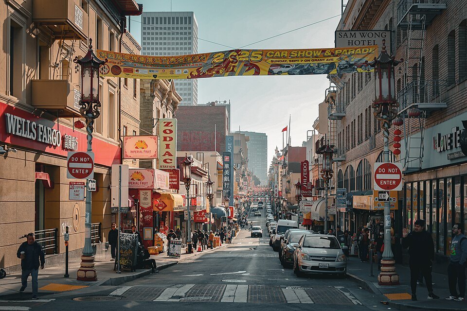 Grant Avenue looking south, a banner strung across the street and the Financial District at its end