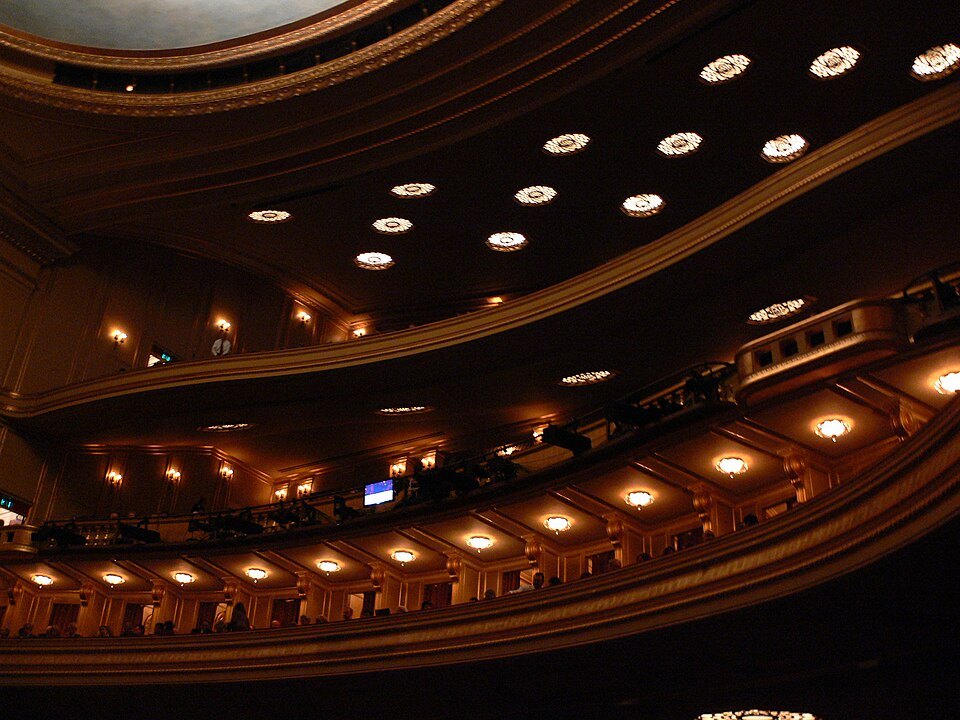 The curved, lamp-lit balconies of the War Memorial Opera House