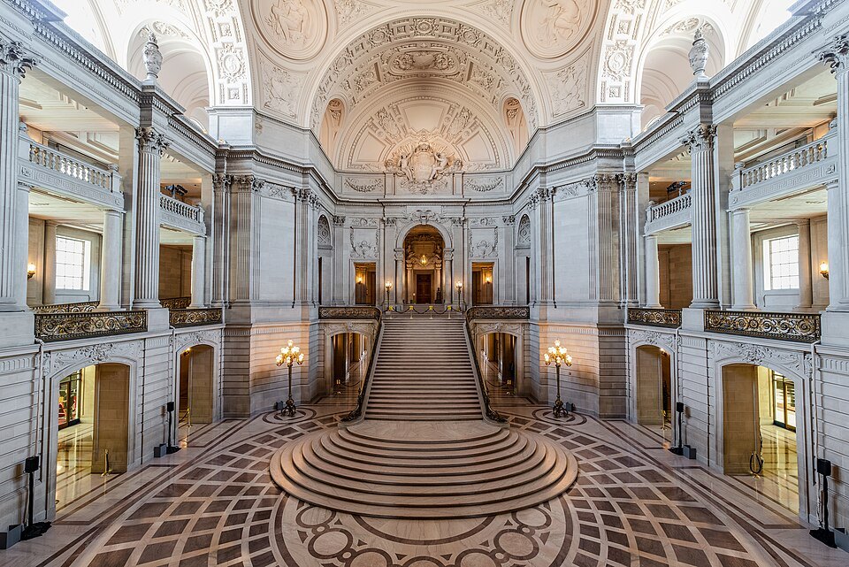 The marble rotunda of City Hall, its staircase climbing to the upper gallery