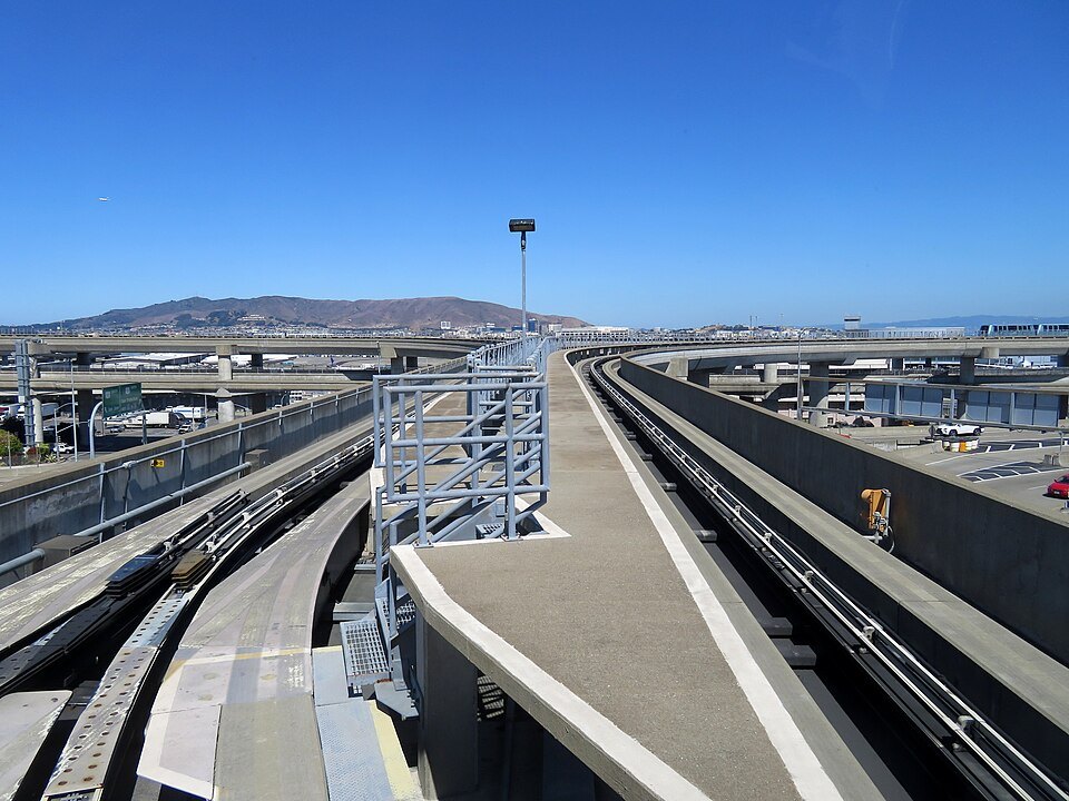 The AirTrain's elevated guideway at SFO, the hills beyond