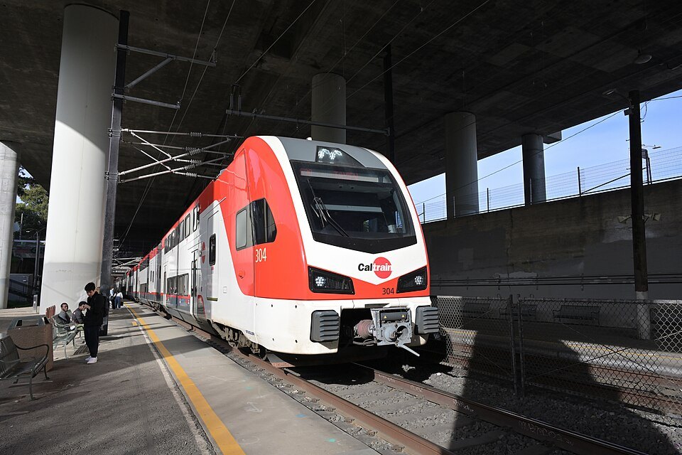 A red-and-white Caltrain train at the 22nd Street station