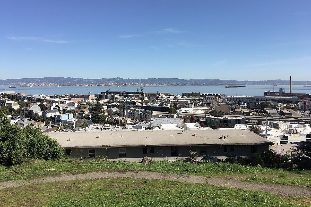 The Dogpatch and the bay from the grass of Potrero Hill