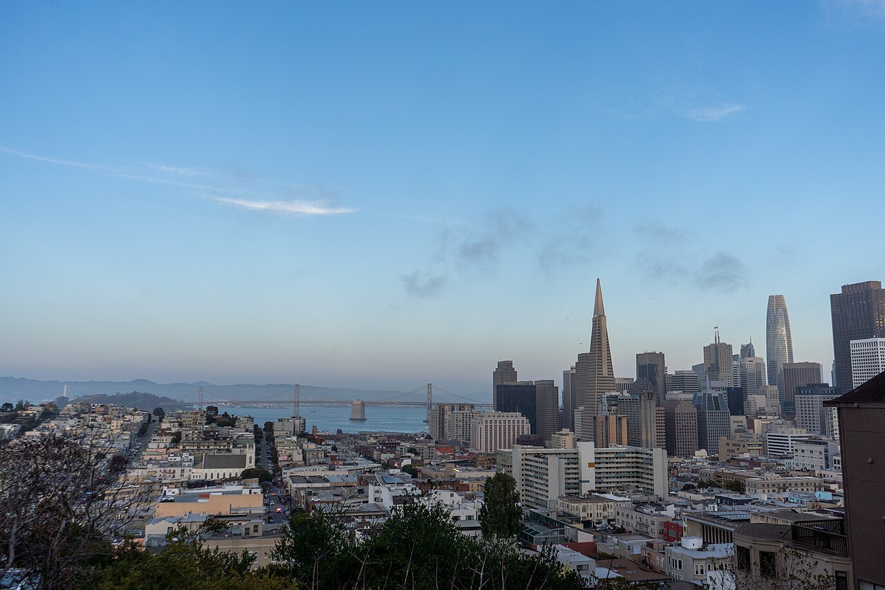 The Transamerica Pyramid and the downtown towers from Russian Hill, the Bay Bridge beyond