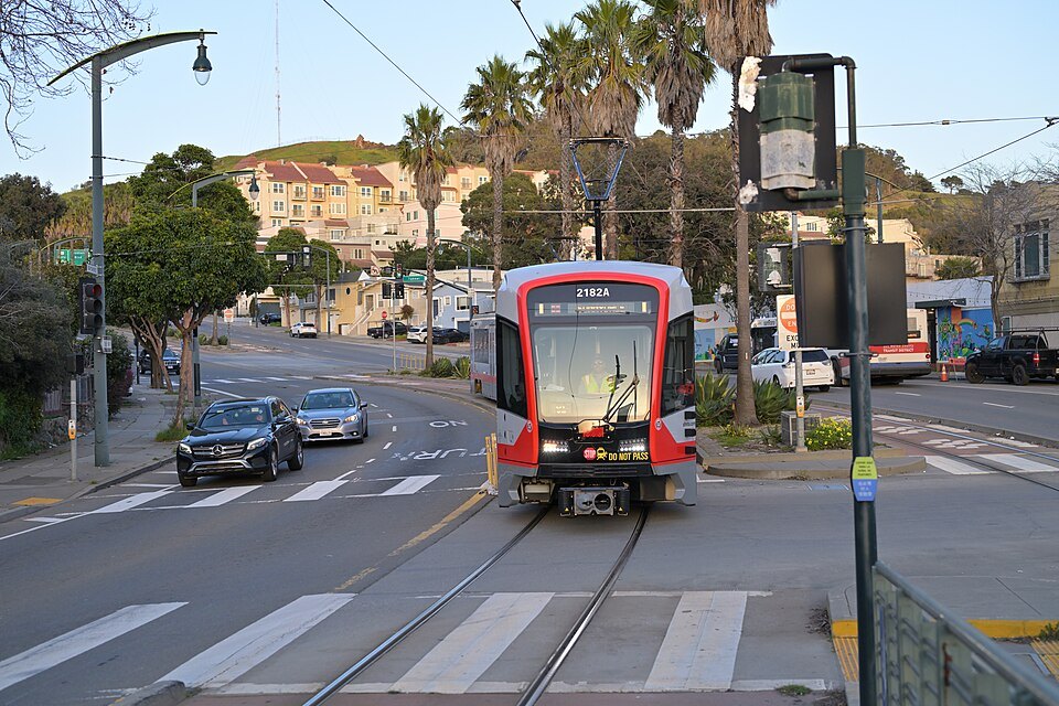 A light-rail train on the T Third Street line approaching a stop