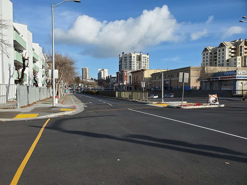 A newly painted crosswalk across a wide street in the Western Addition