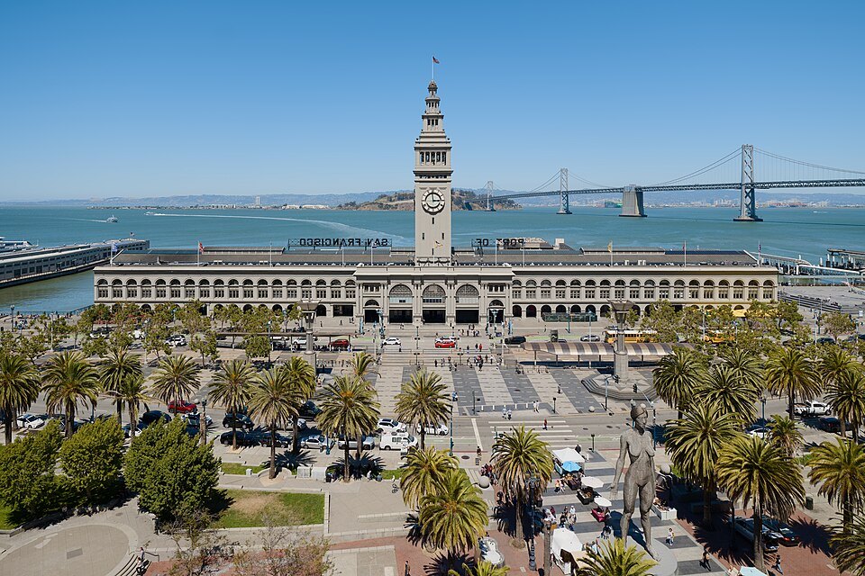 The Ferry Building and its plaza from above, the Bay Bridge and Treasure Island behind