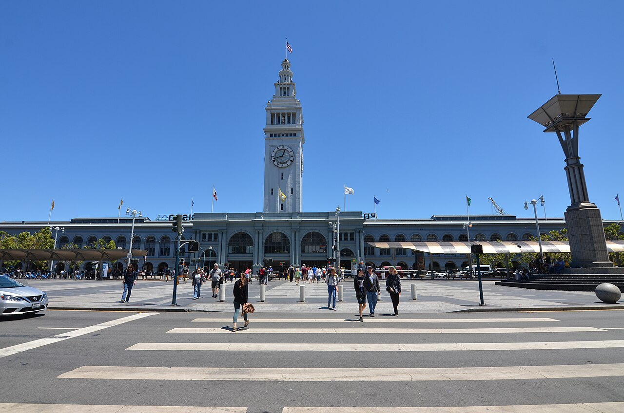 The Ferry Building and its clock tower across the Embarcadero plaza