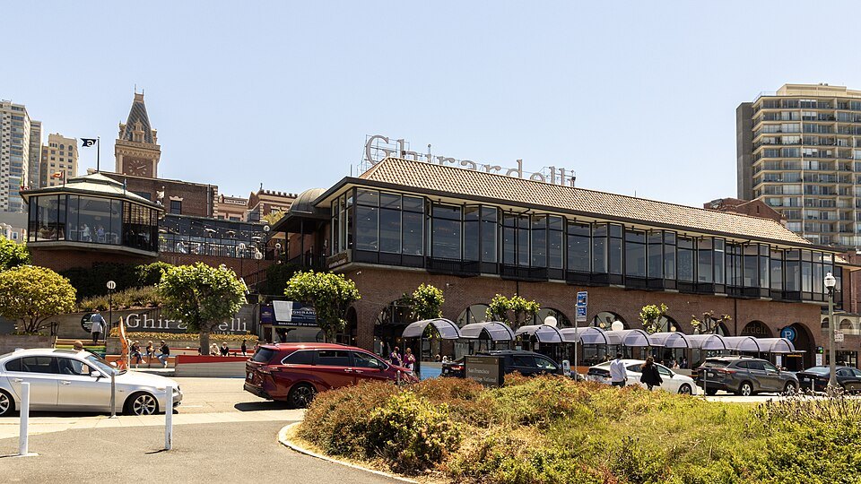 Ghirardelli Square's brick buildings and gardens above the waterfront