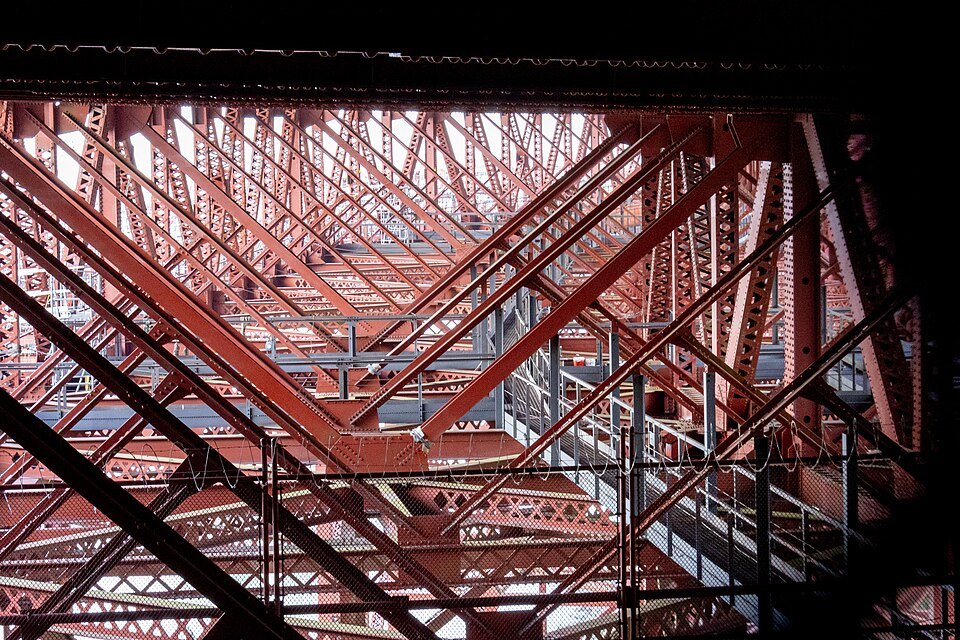 The steel lattice of the arch that carries the roadway over Fort Point