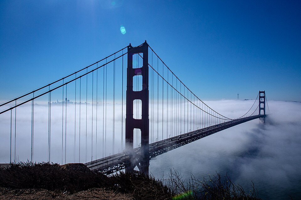 The bridge's north tower above a bank of fog, from Battery Spencer