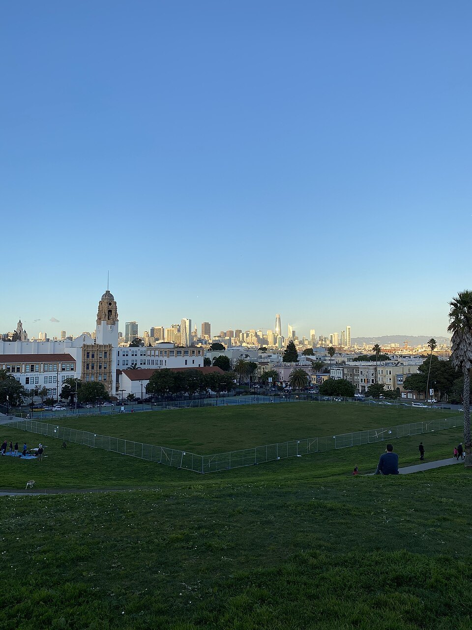 Mission Dolores Park at sunset, downtown on the horizon