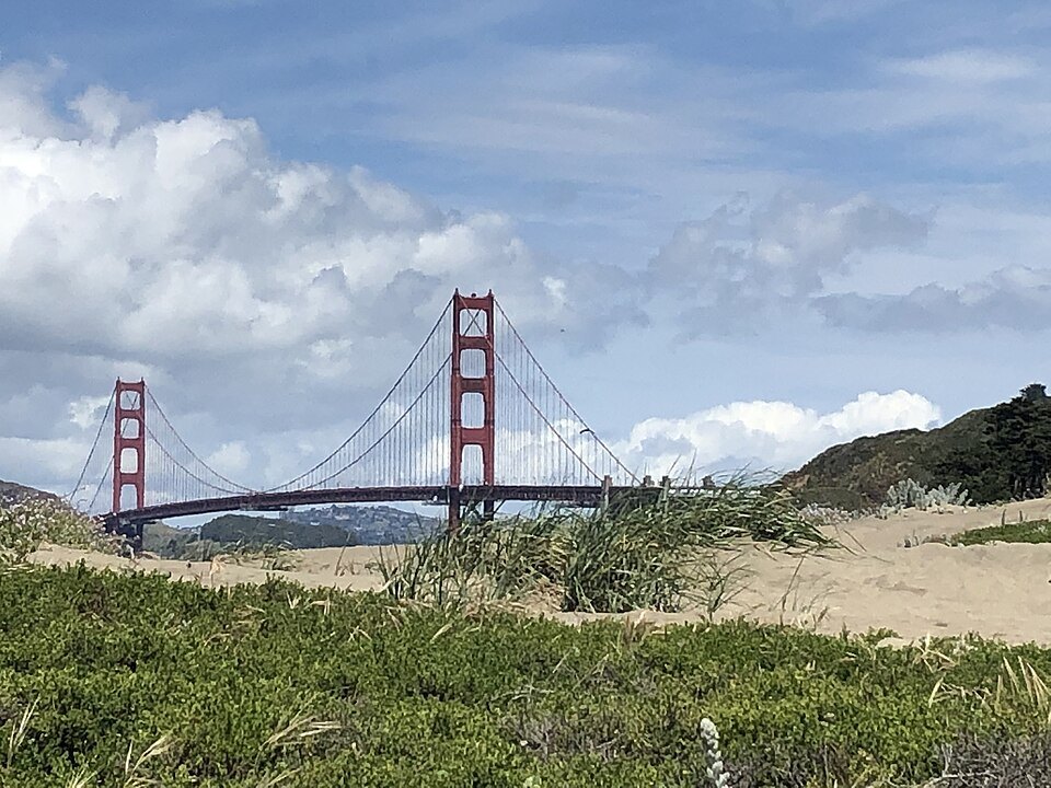 The Golden Gate Bridge beyond the dunes and beach grass of Crissy Field