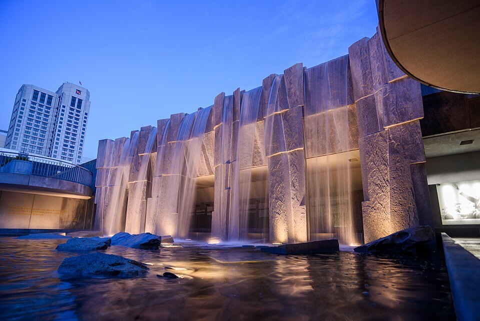 The waterfall of the Martin Luther King Jr. Memorial in Yerba Buena Gardens, lit at dusk