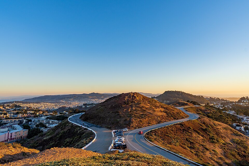The road looping around Twin Peaks at golden hour