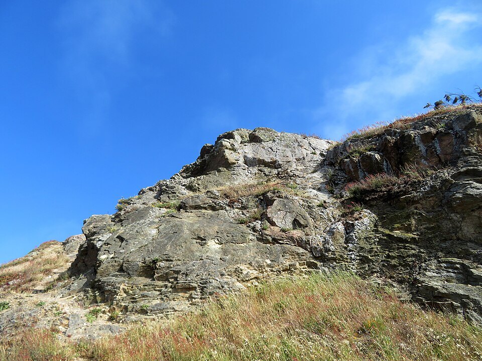 The rocky summit of Tank Hill against a clear sky