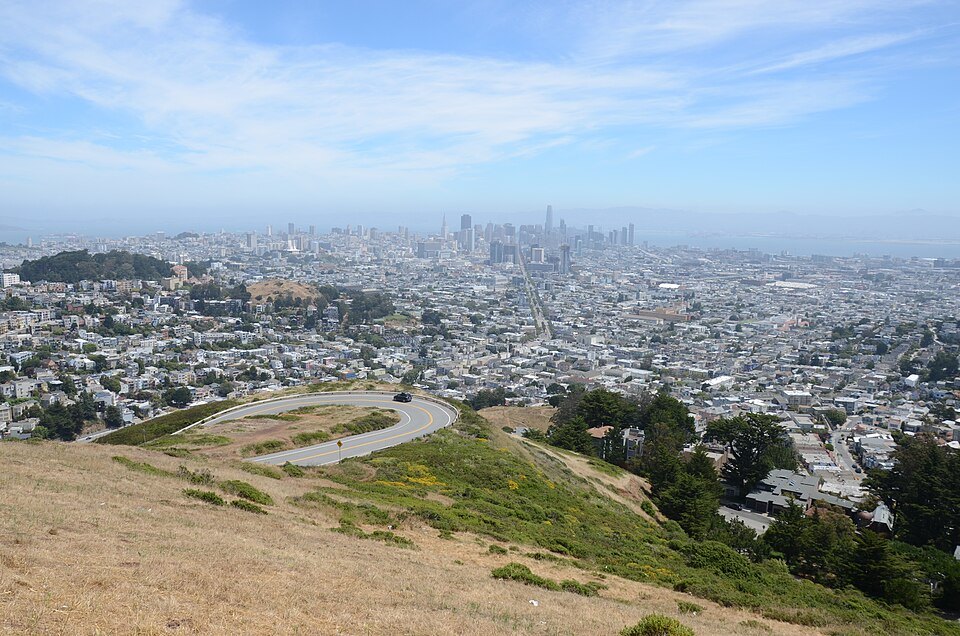 The city and the bay from the grassy slopes of Twin Peaks